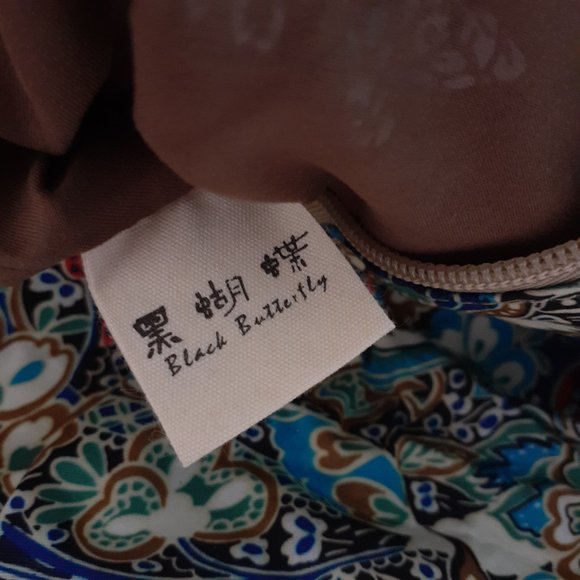 Black Butterfly Canvas Backpack in a Blue Floral Print - Picture 3 of 12